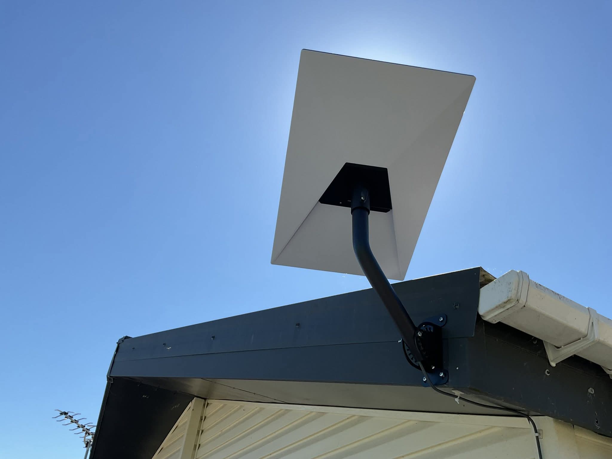 Installed Starlink dish mounted with a clear sky view
