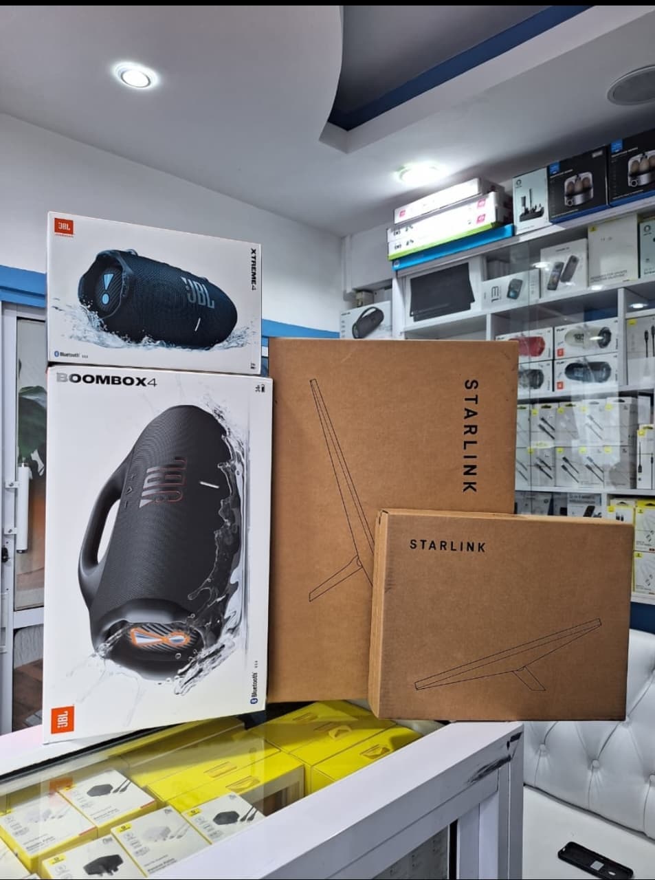 Starlink boxes displayed in a retail electronics shop