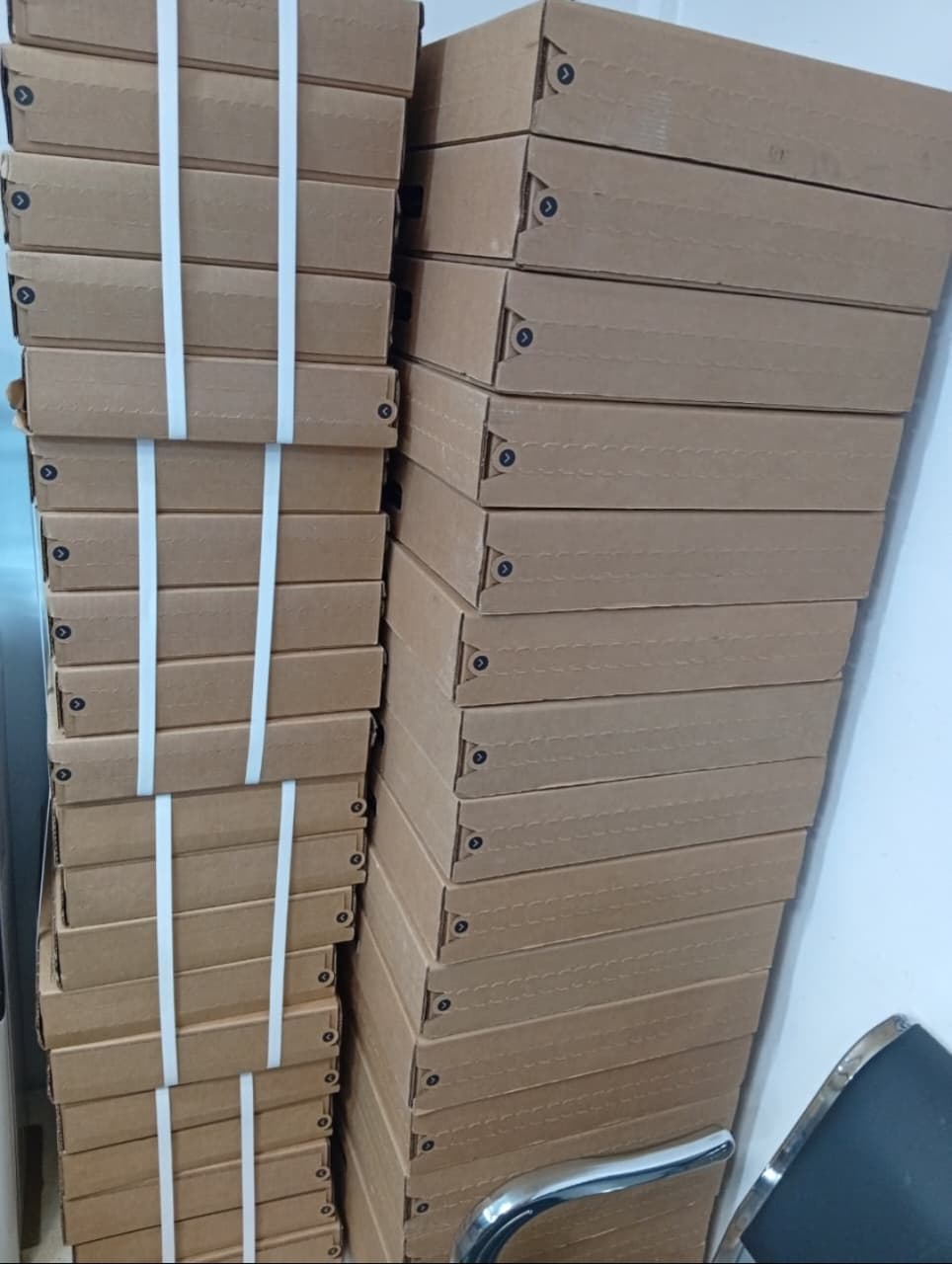 Tall strapped stacks of Starlink boxes