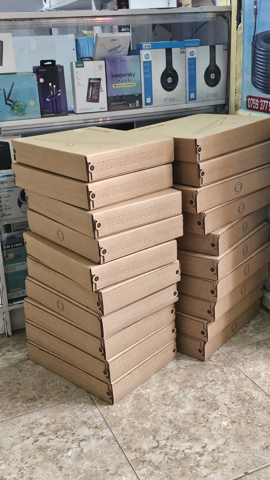 Starlink boxes stacked in a retail shop