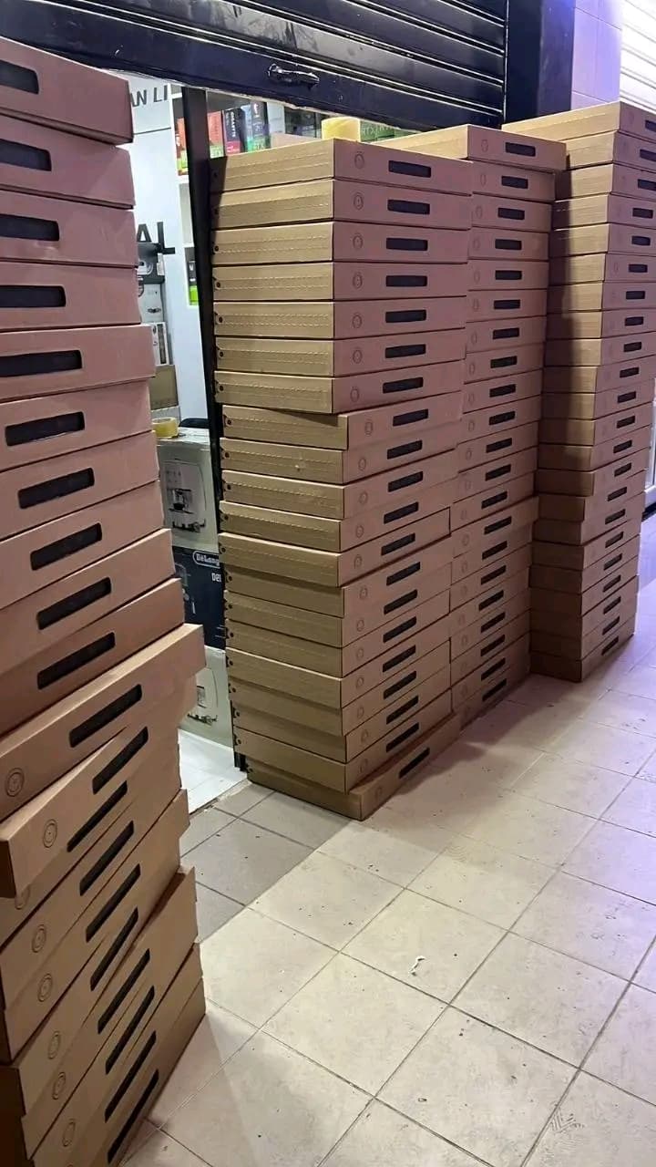 Tall stacks of Starlink boxes outside a shop