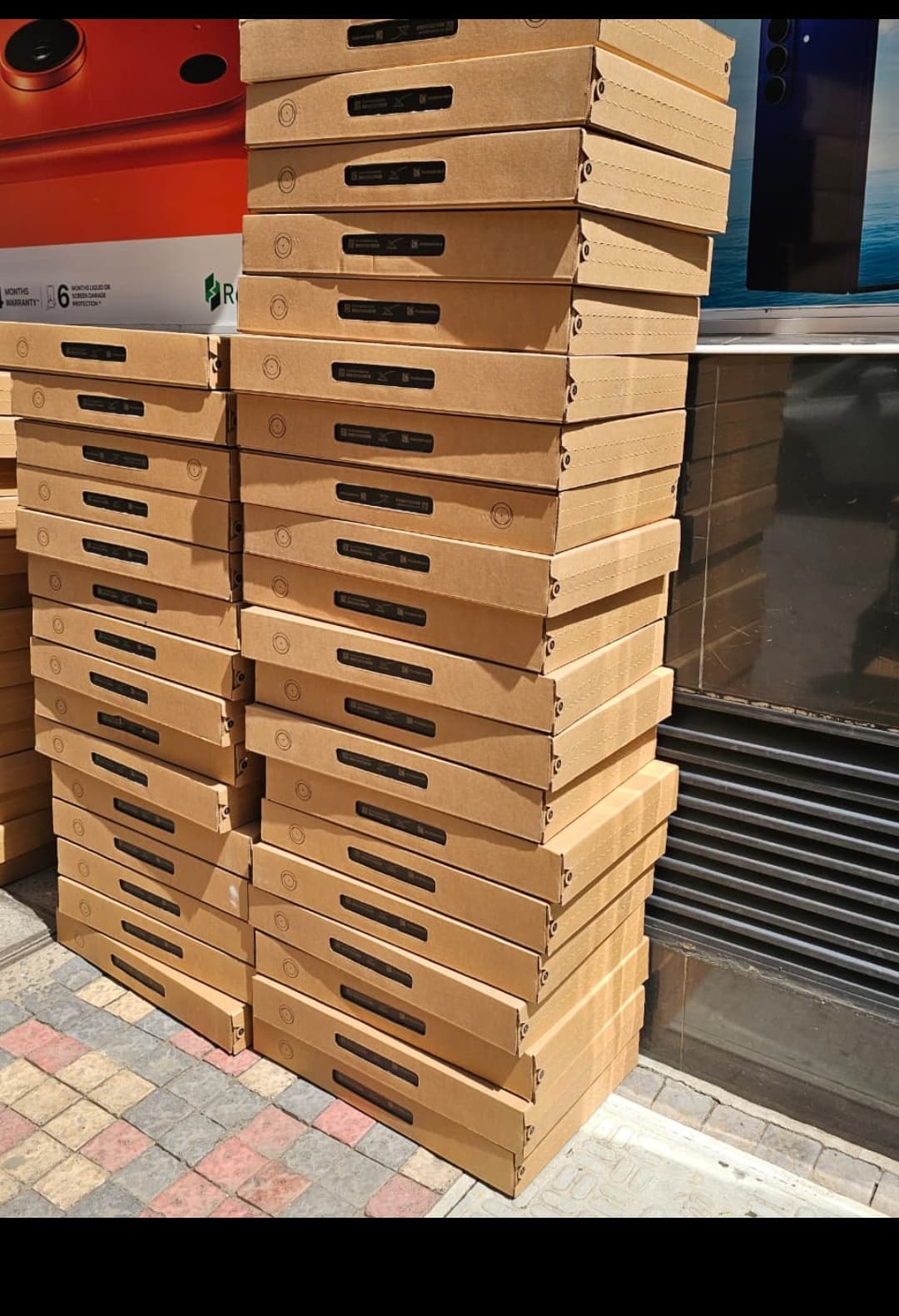 Starlink inventory stacked outside a storefront