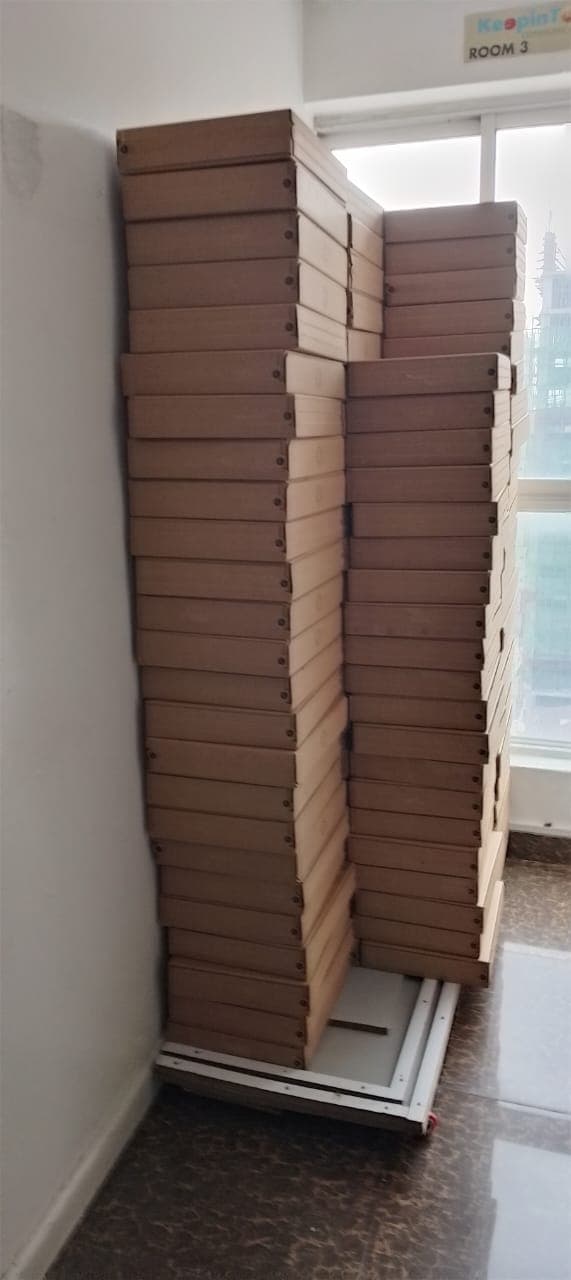 Starlink boxes stacked near a window