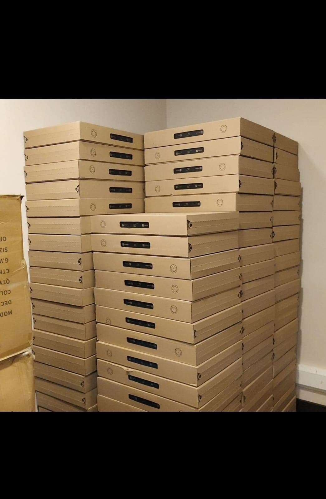 Starlink boxes stacked in a warehouse corner