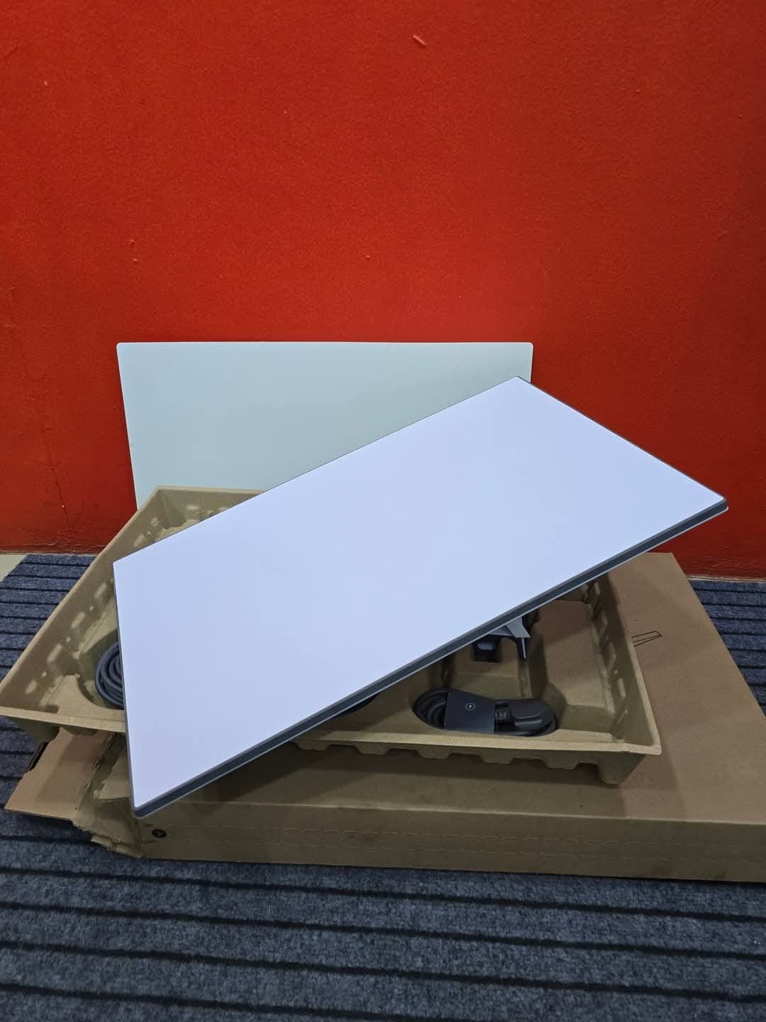Starlink kit unpacked with dish placed over the box